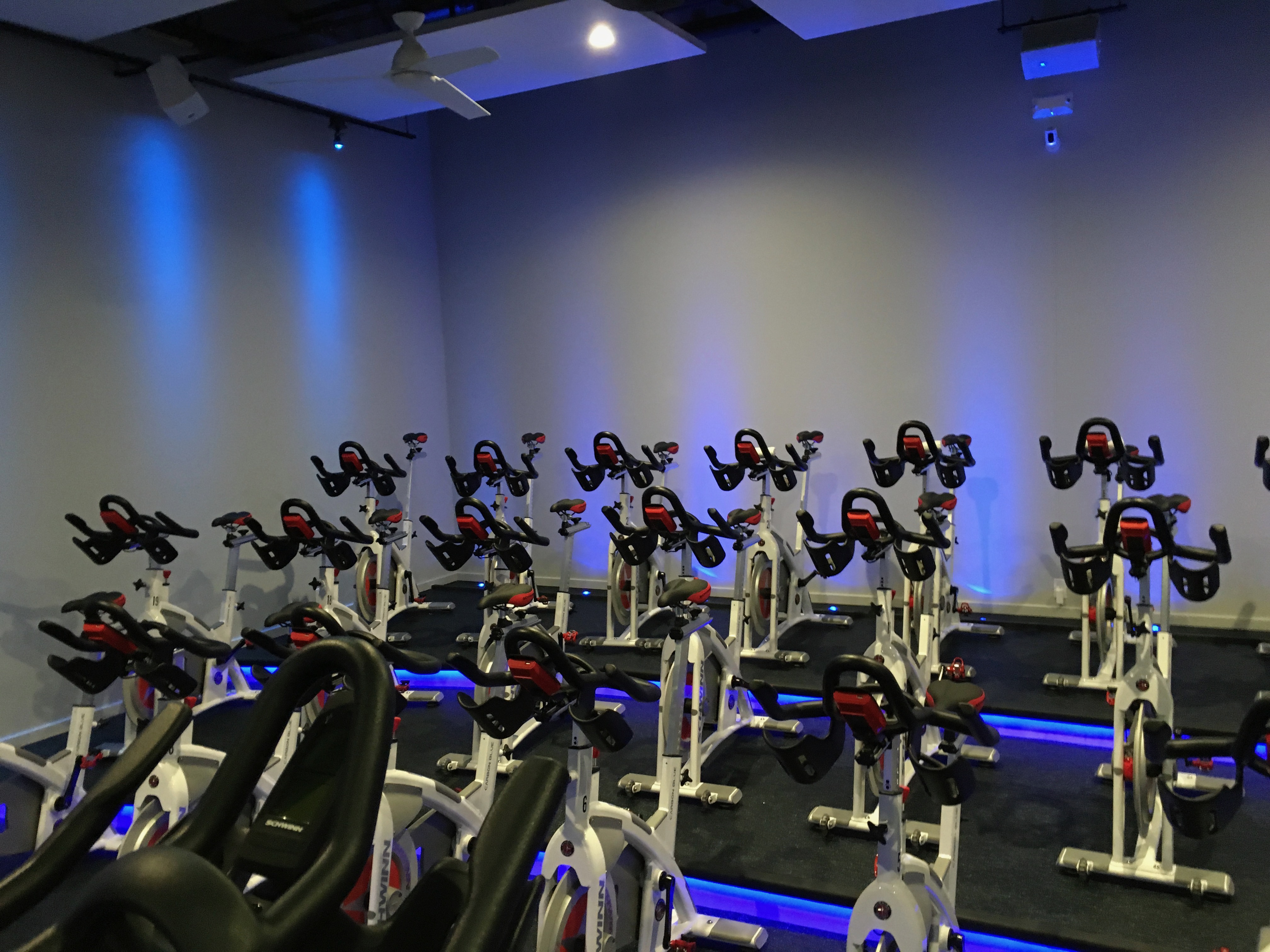 DIG cycling studio with blue theater lighting