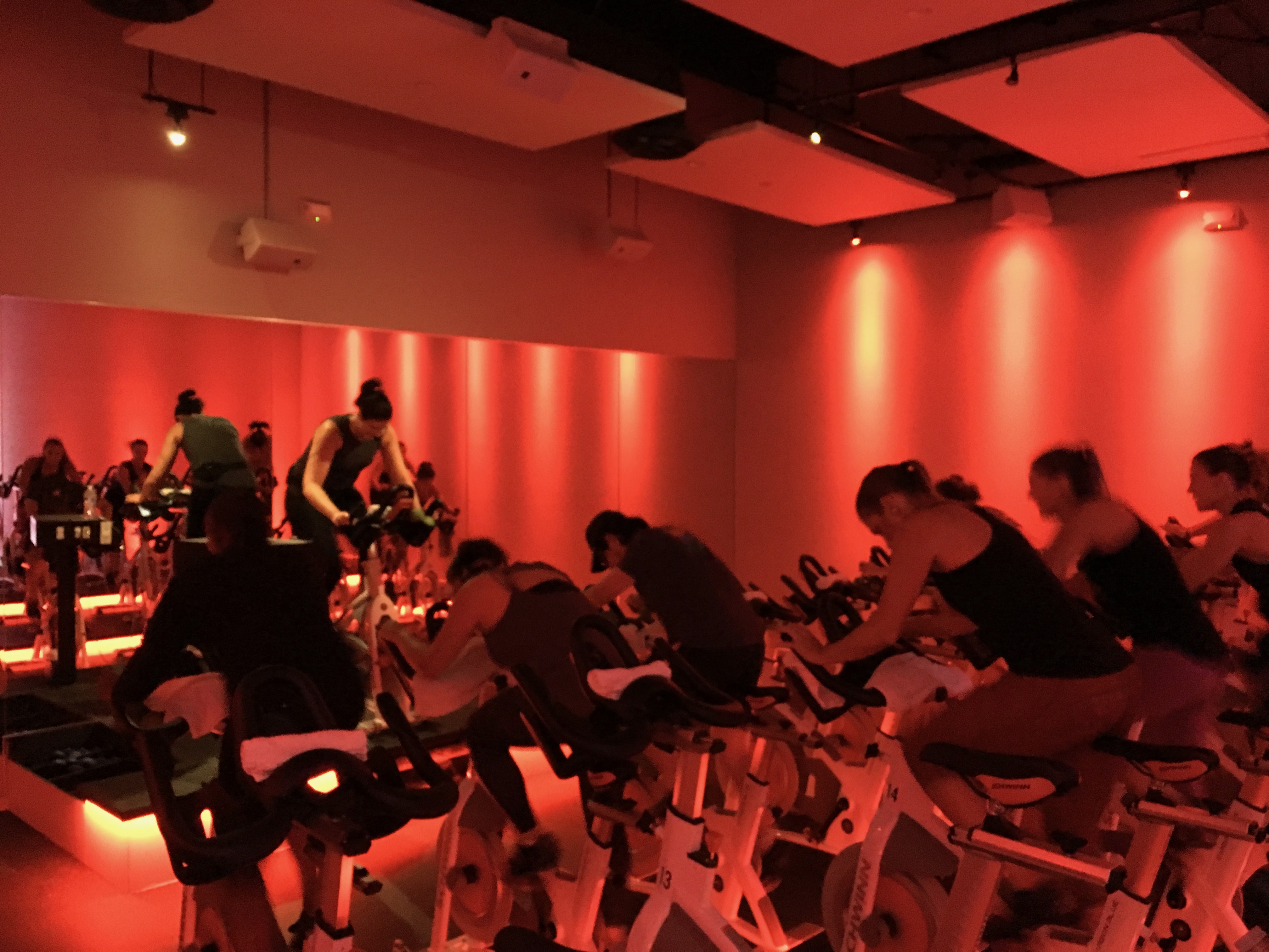 DIG Ride class under red theater lighting